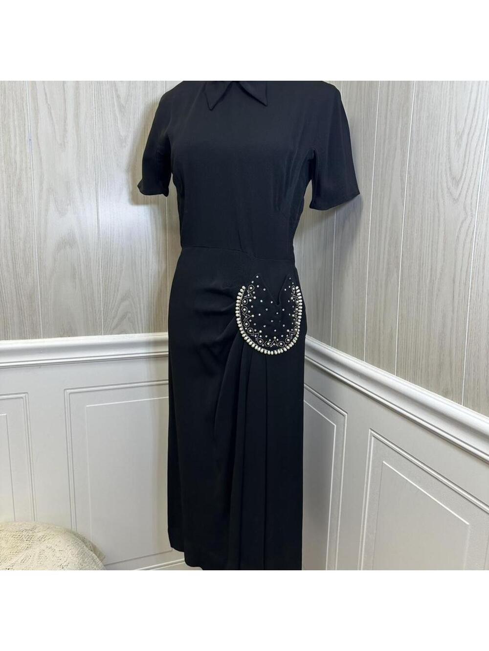 1940s vintage Paul Sachs black dress w/ a pearl & rhinestone pocket on the side.